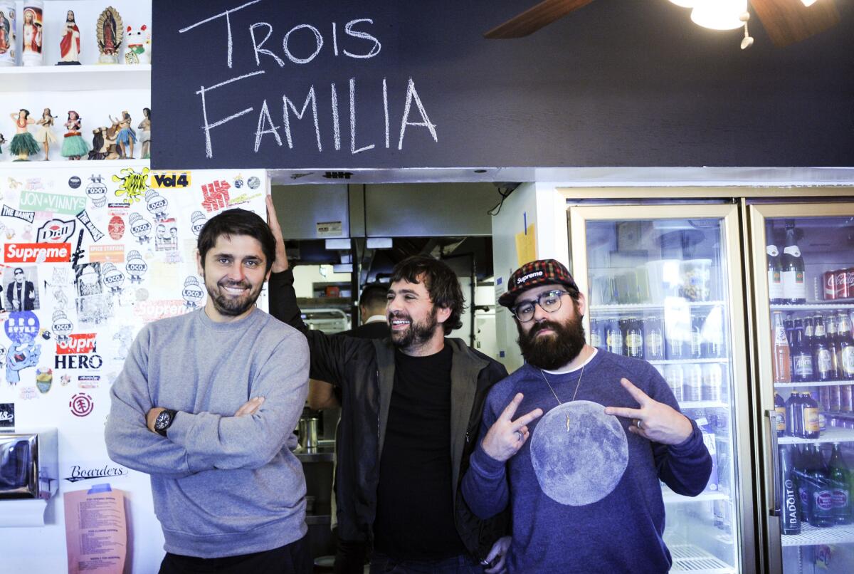 Ludo Lefebvre, left, Jon Shook and Vinny Dotolo, right, at their restaurant, Trois Familia.