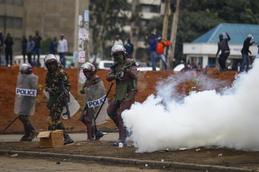 FILE - Riot police fire tear gas grenades at demonstrators during protests in the capital Nairobi, Kenya on July 7, 2023. The United States is praising Kenya's interest in leading a multinational force in Haiti. But weeks ago, the U.S. openly warned Kenyan police officers against violent abuses. Now 1,000 of those police officers might head to Haiti to take on gang warfare. (AP Photo/Brian Inganga, File)