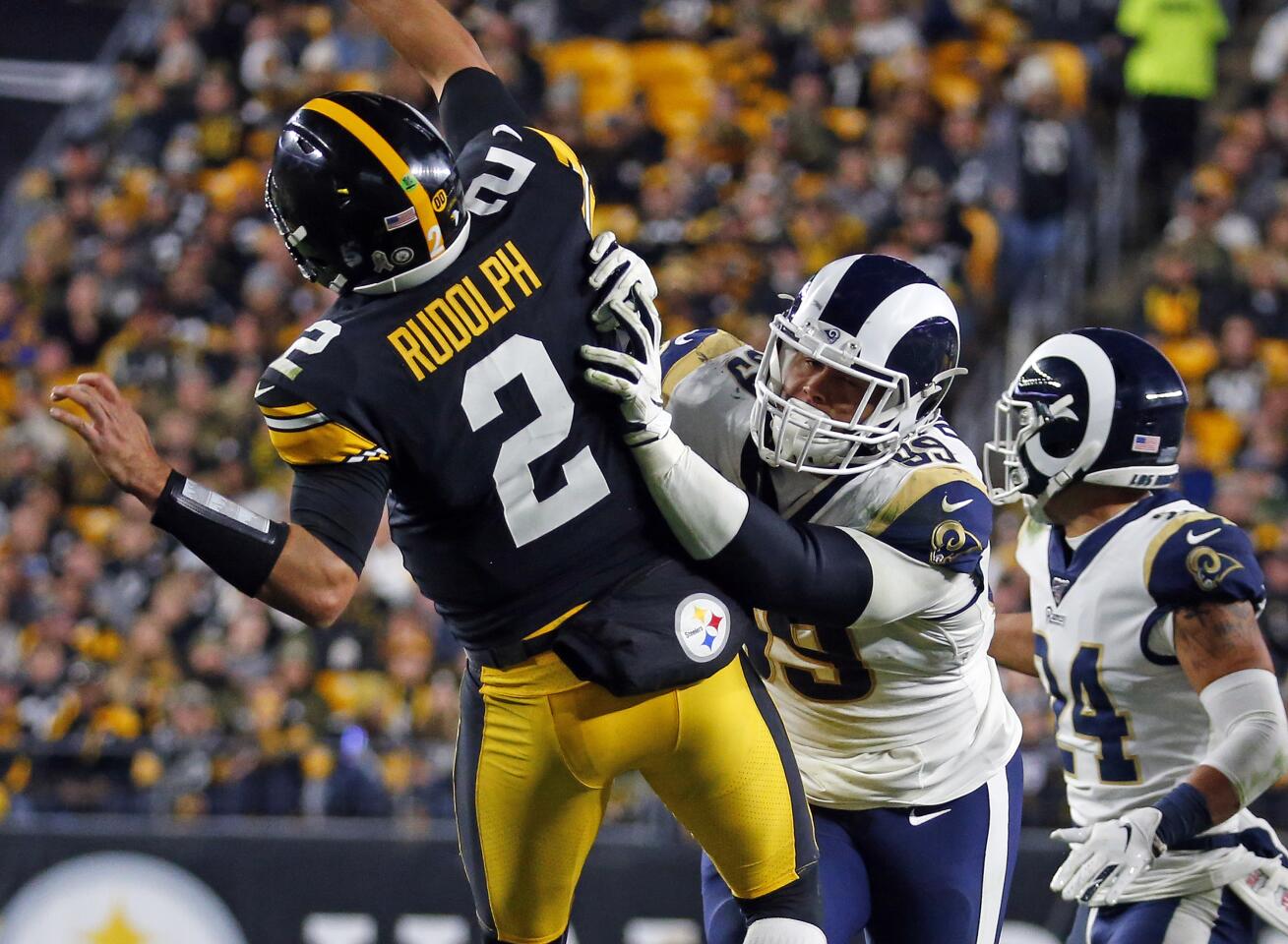 Rams defensive tackle Aaron Donald shoves Pittsburgh Steelers quarterback Mason Rudolph