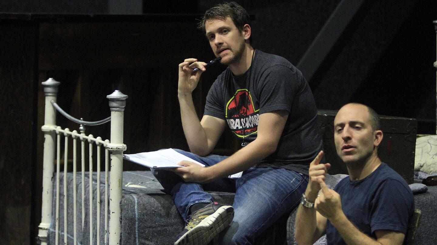 Director Michael Arden, left, and interpreter Alek Lev work with the cast during a rehearsal.