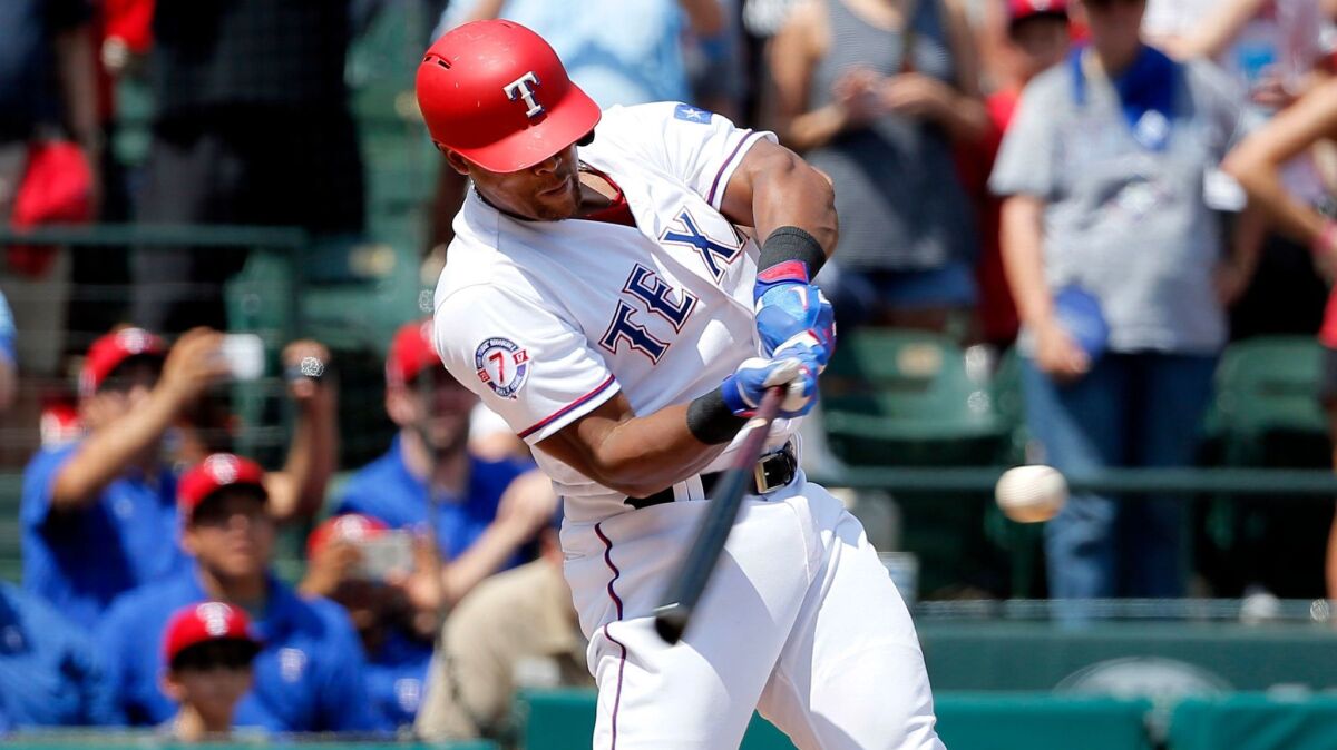 Rangers third baseman Adrian Beltre connects for a double during the fourth inning Sunday, the 3,000th hit of his career