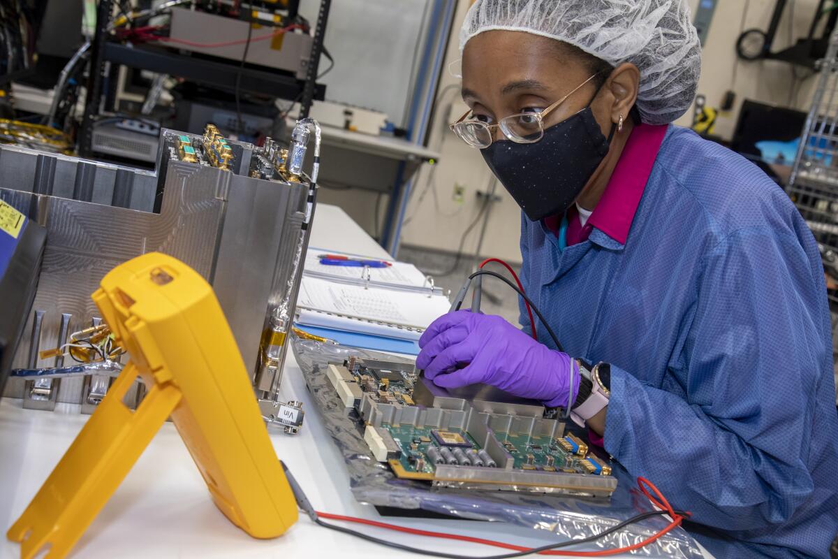 Engineer Yvette Tyler performs integration and testing on the electronics box for Europa Clipper’s mass spectrometer. 