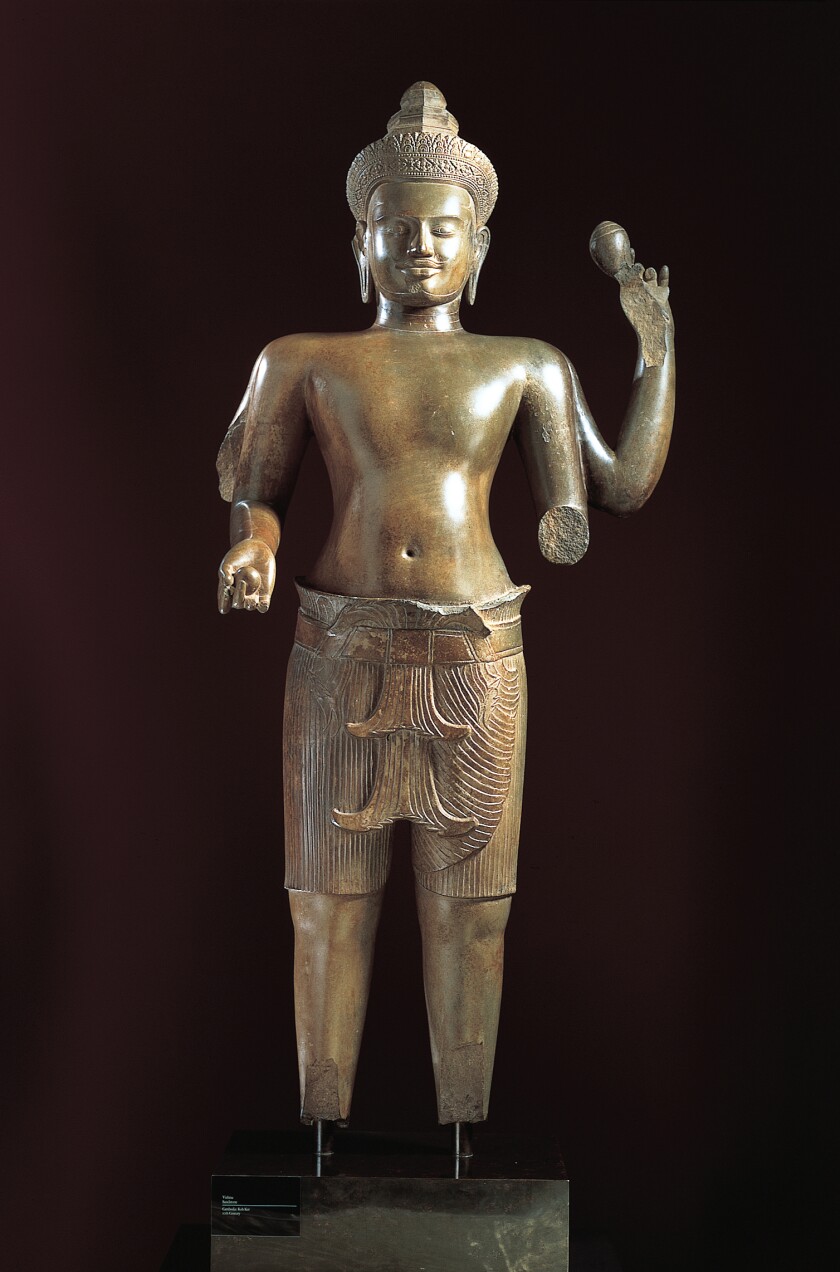 A polished sandstone sculpture of the Hindu god Vishnu.