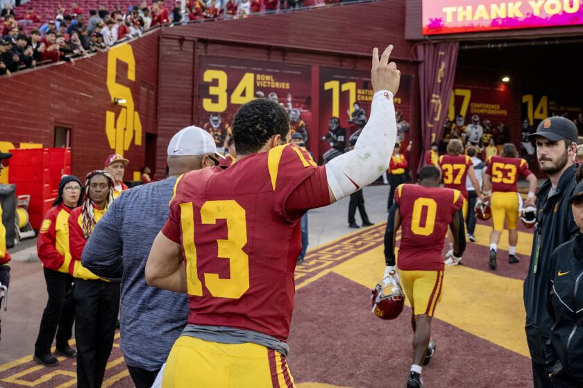LOS ANGELES, CA - NOVEMBER 18, 2023: USC Trojans quarterback Caleb Williams (13) waves goodbye.