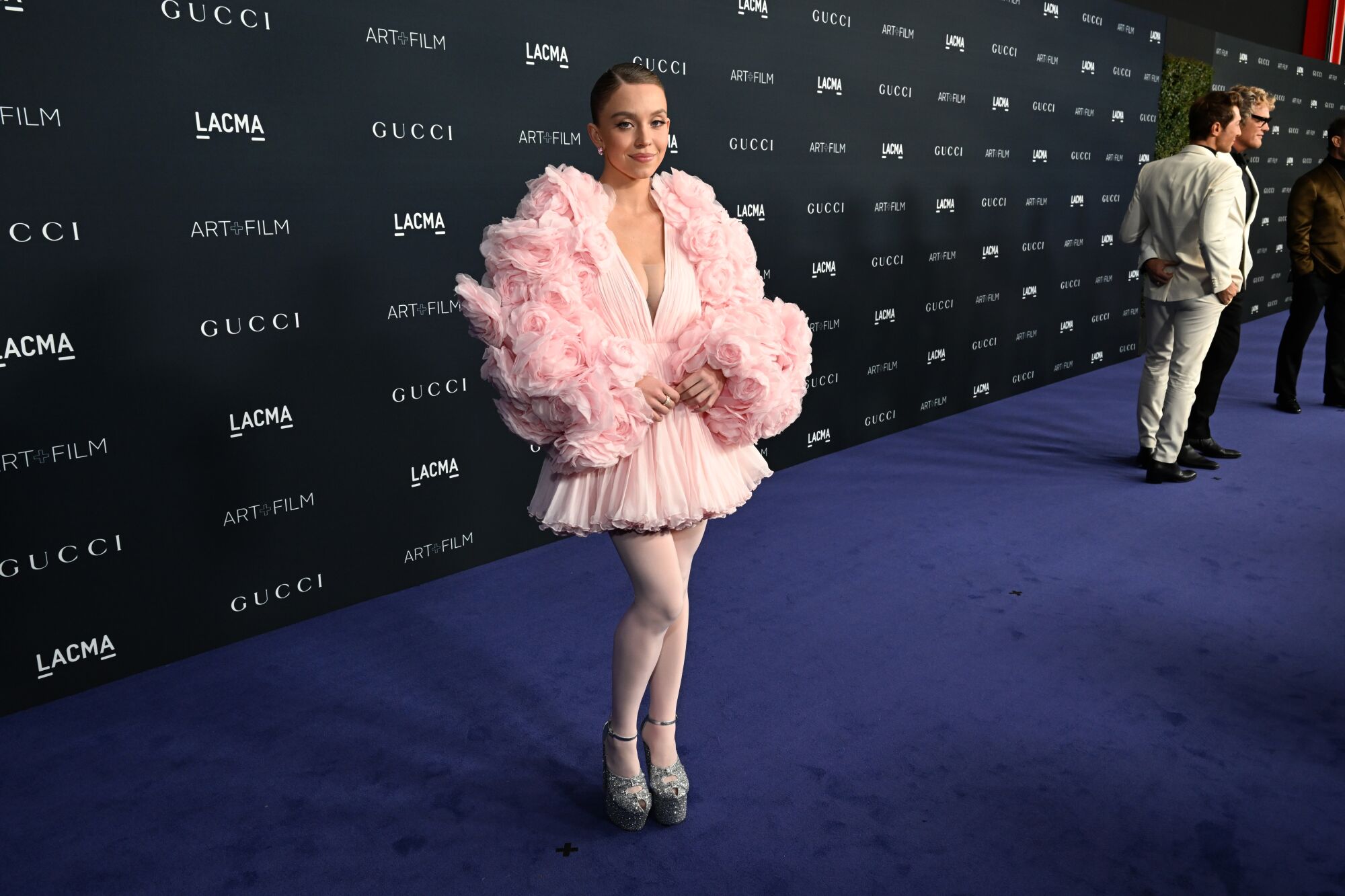 Sydney Sweeney in a pink dress