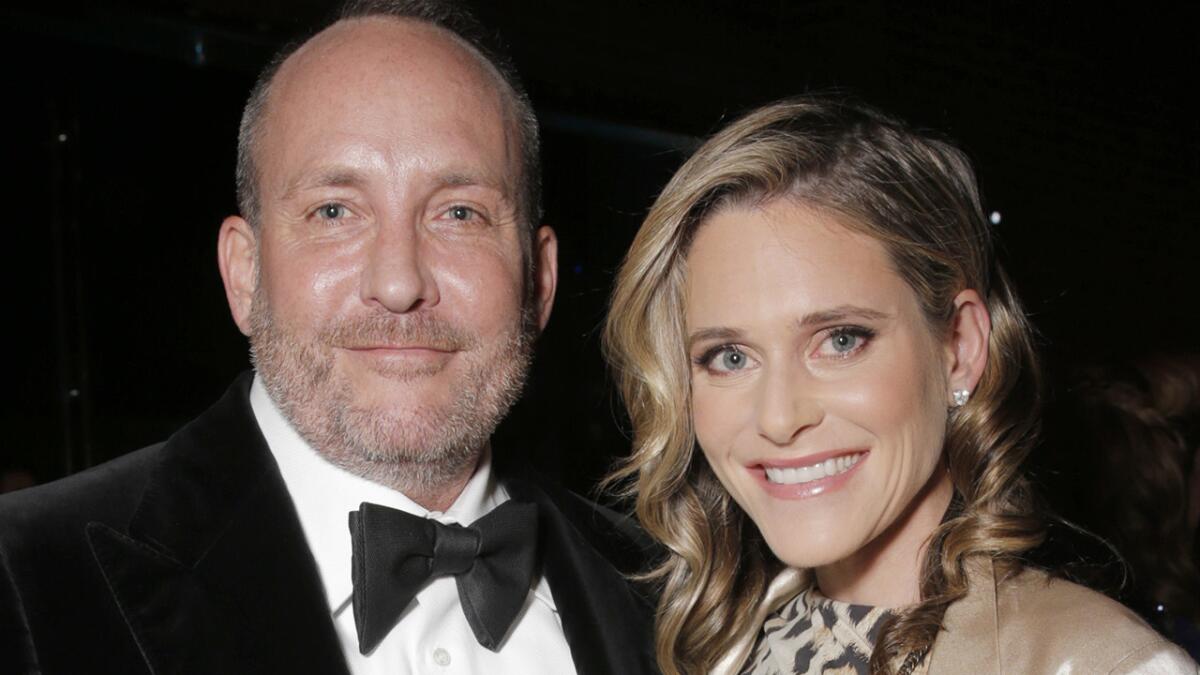 Producer Christopher Eberts attends a gala with wife Kristin. He was ordered to pay nearly $1.2 million in damages for a film he failed to make.