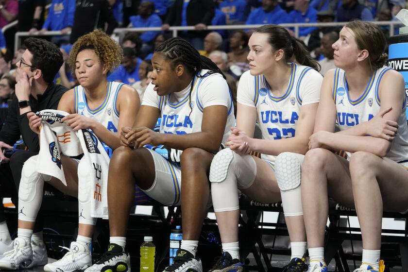UCLA players react on the bench during the fourth quarter of their Sweet Sixteen loss to LSU Saturday in Albany, N.Y.