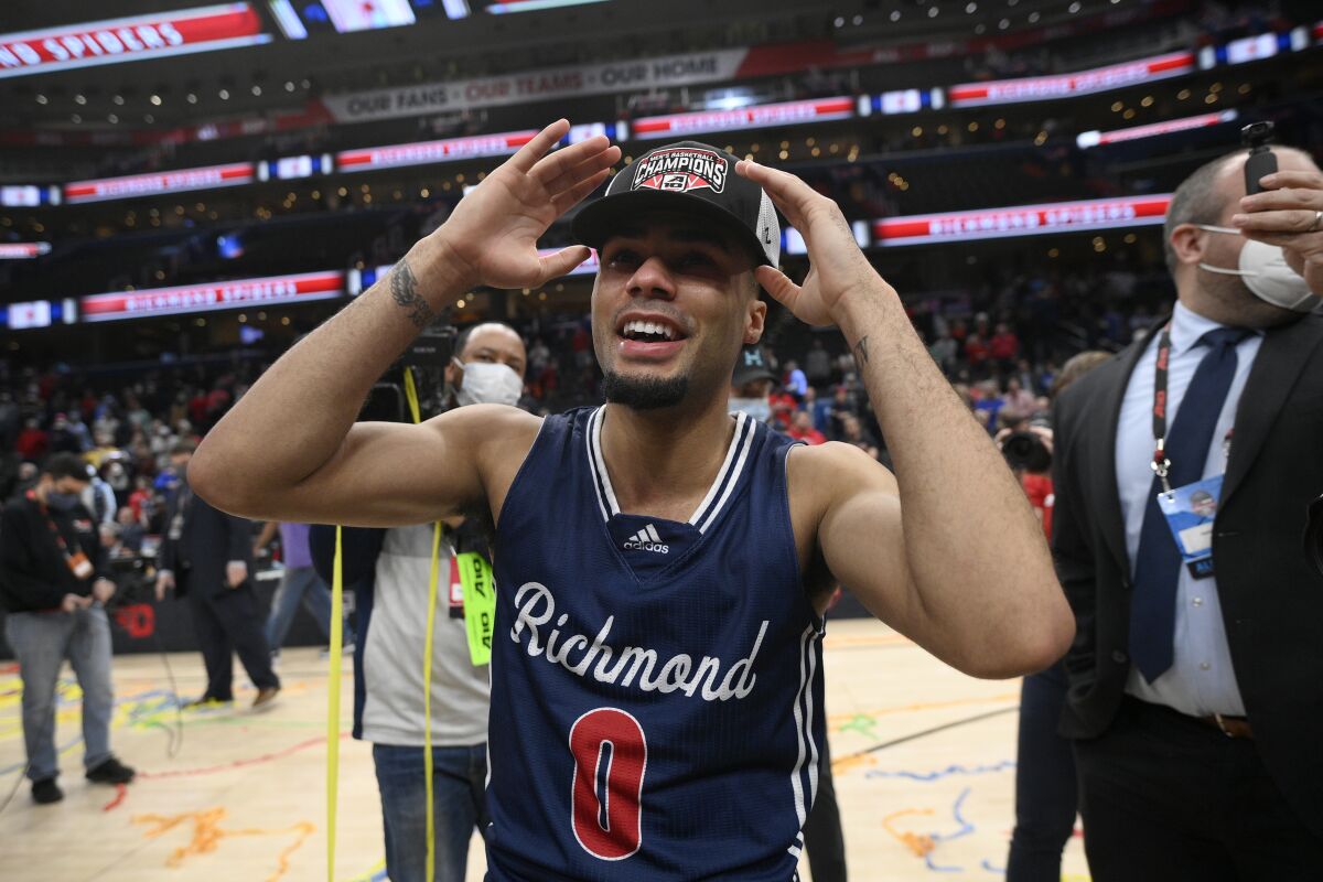 Richmond guard Jacob Gilyard (0) reacts after an NCAA college basketball game in the championship of the Atlantic 10 Conference tournament against Davidson, Sunday, March 13, 2022, in Washington. (AP Photo/Nick Wass)