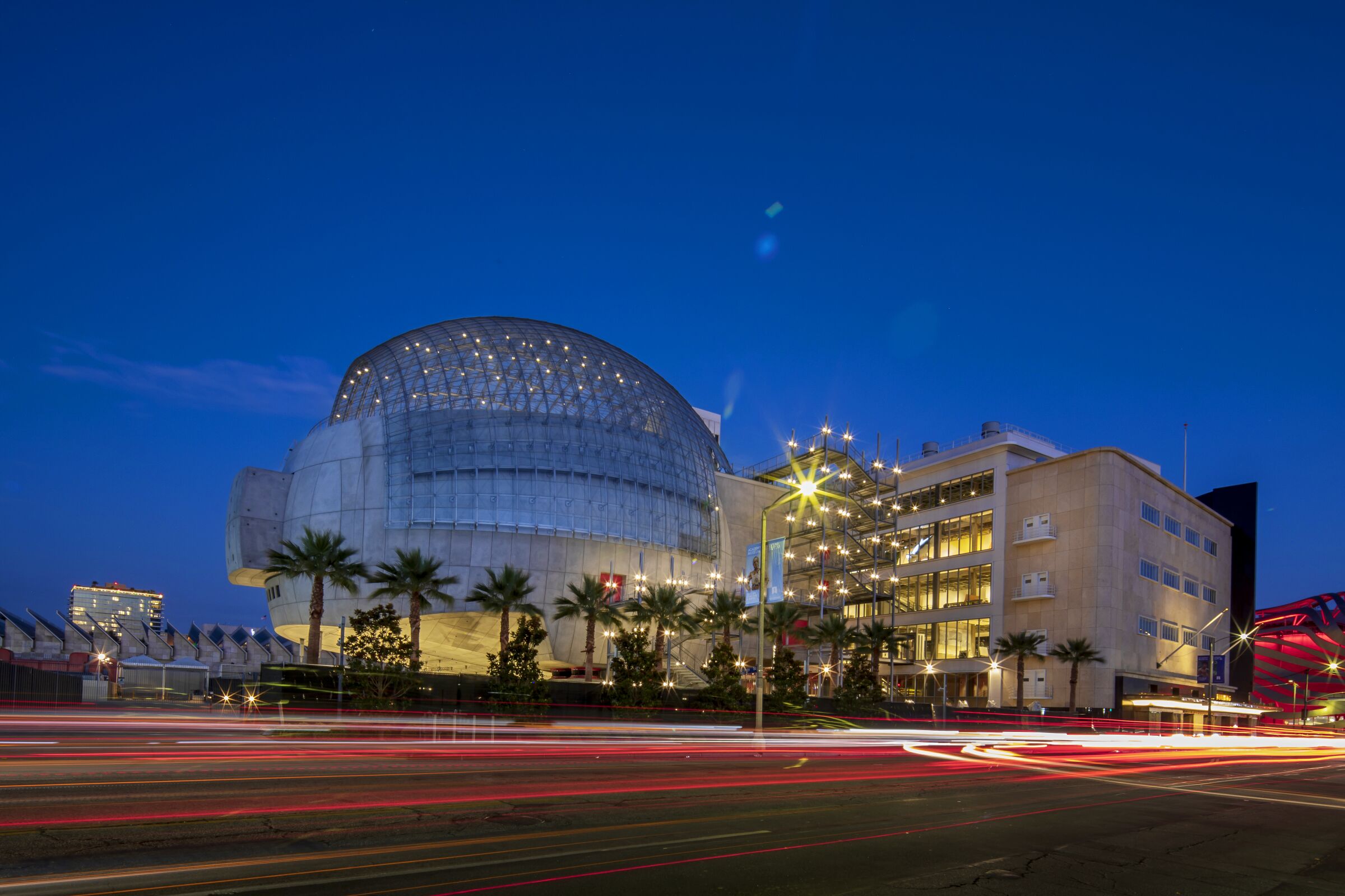 The Academy Museum of Motion Pictures, seen at dusk, with its giant spherical theater.