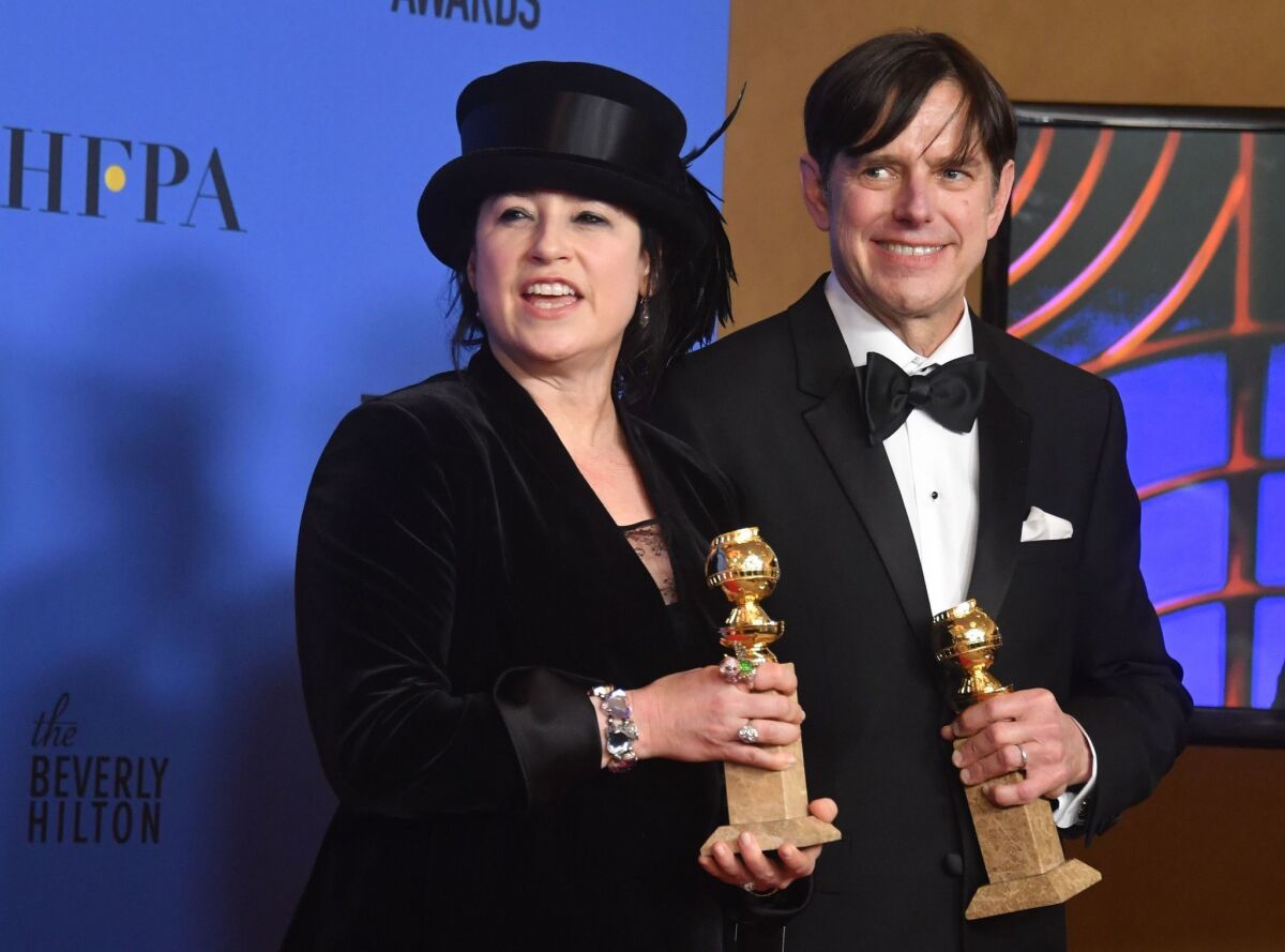 "The Marvelous Mrs. Maisel" creators Amy Sherman-Palladino, left, and Daniel Palladino after their win for best TV series comedy.