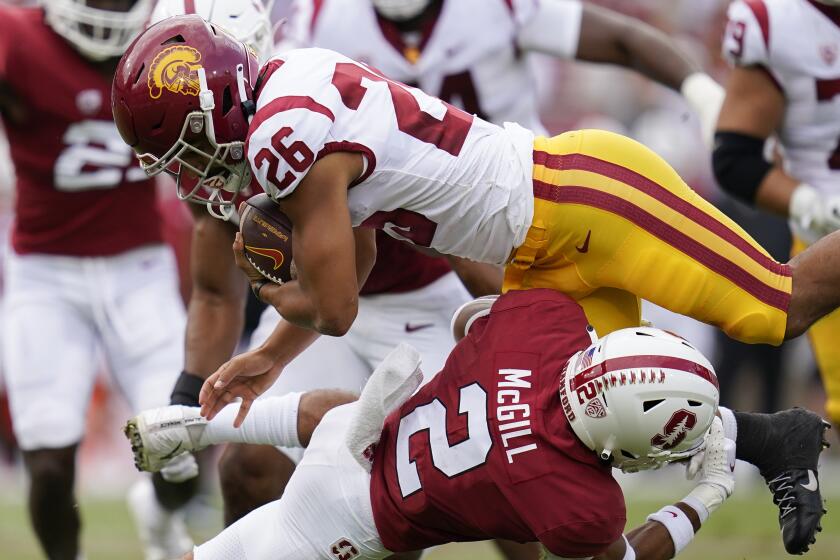 Stanford safety Jonathan McGill (2) tackles Southern California running back Travis Dye.
