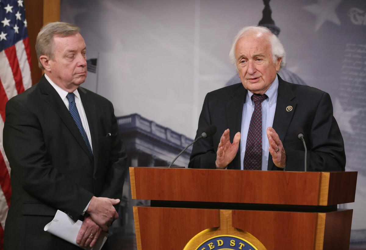 Rep. Sander Levin (D-Mich.), right, and Sen. Dick Durbin (D-Ill.) during a Capitol Hill news conference Tuesday during which they announced legislation to tighten restrictions on corporate tax inversions.