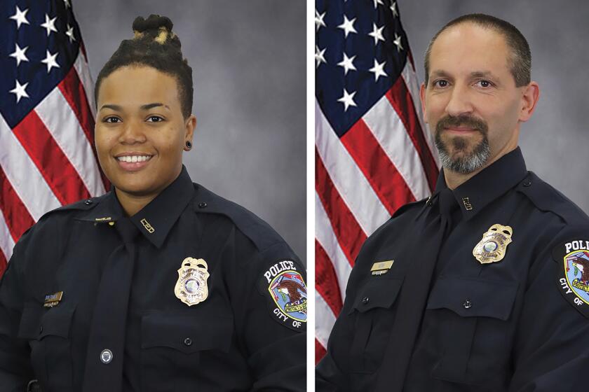 FILE - These images provided by the City of La Vergne shows La Vergne Police Officers Ashely Boleyjack and Gregory Kern. The estranged son of Nashville’s police chief, who was wanted in the shooting of two police officers outside a Dollar General store, has been found dead, authorities said. (City of La Vergne via AP)