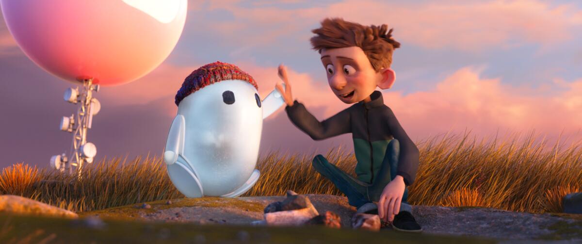 A small robot high-fives  a boy in the animated movie "Ron's Gone Wrong."