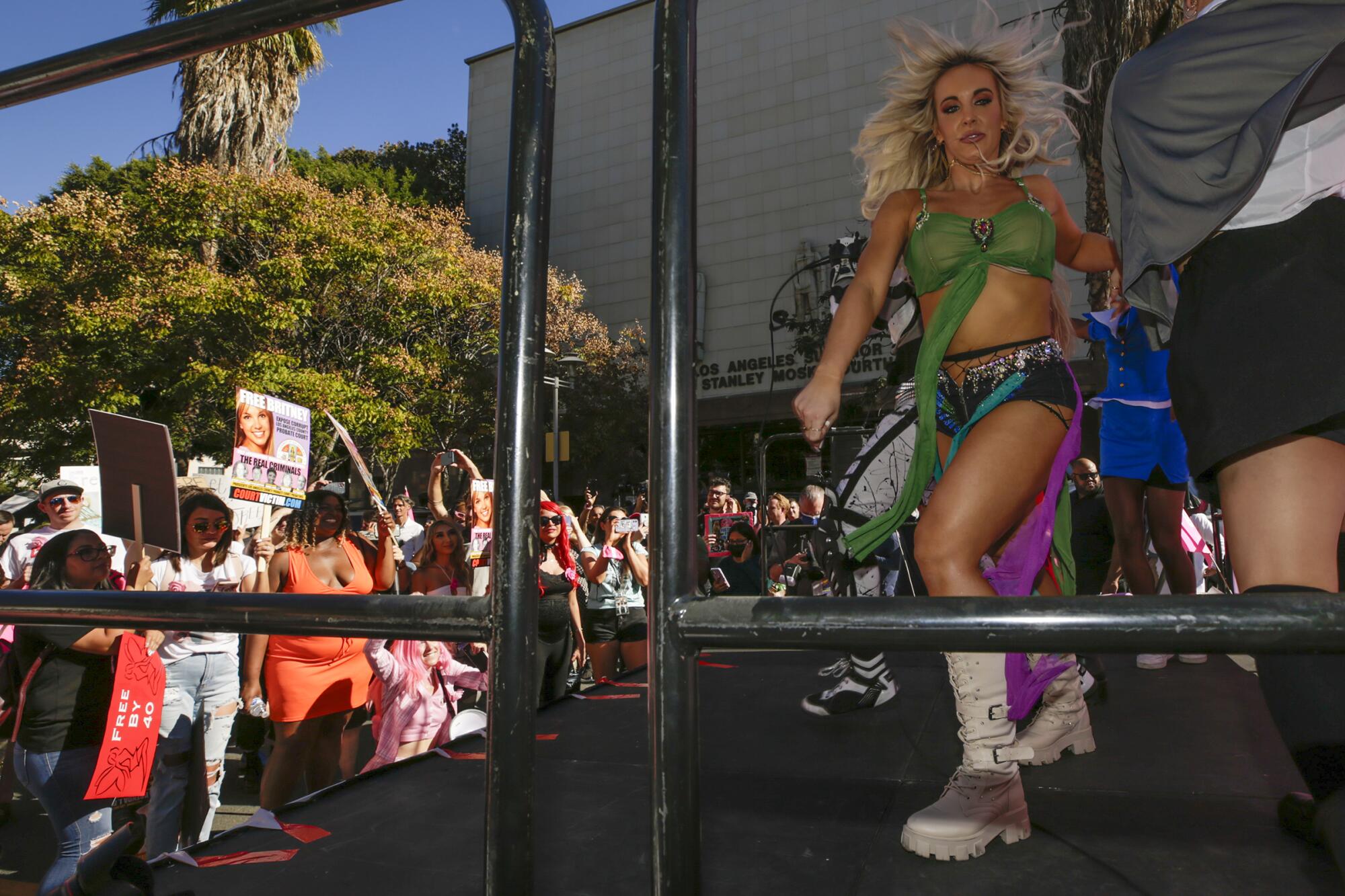 A Britney Spears impersonator dances during the rally.