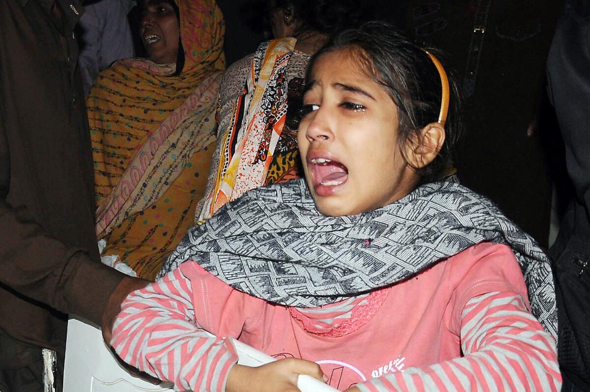 A Pakistani mourns blast victims at a hospital in Lahore after a suicide bomb attack near the Wagah border gate on Nov. 2.