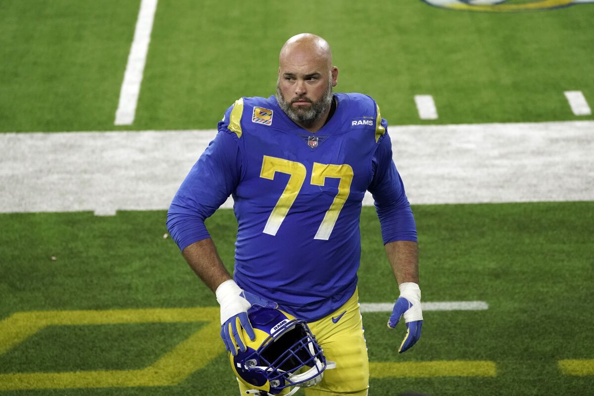 Rams offensive tackle Andrew Whitworth walks off the field last season.