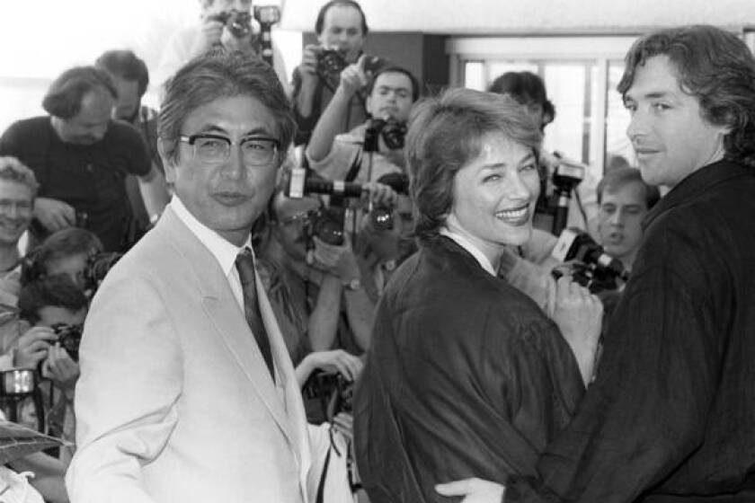 Nagisa Oshima, left, accompanies actors Charlotte Rampling and Anthony Higgins to the presentation of his film "Max Mon Amour" at the Cannes International Film Festival in 1986.