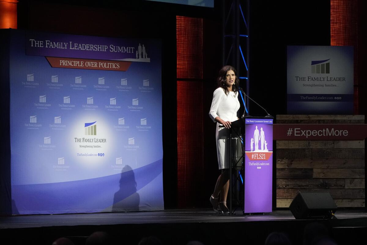 South Dakota Gov. Kristi Noem speaking from lectern