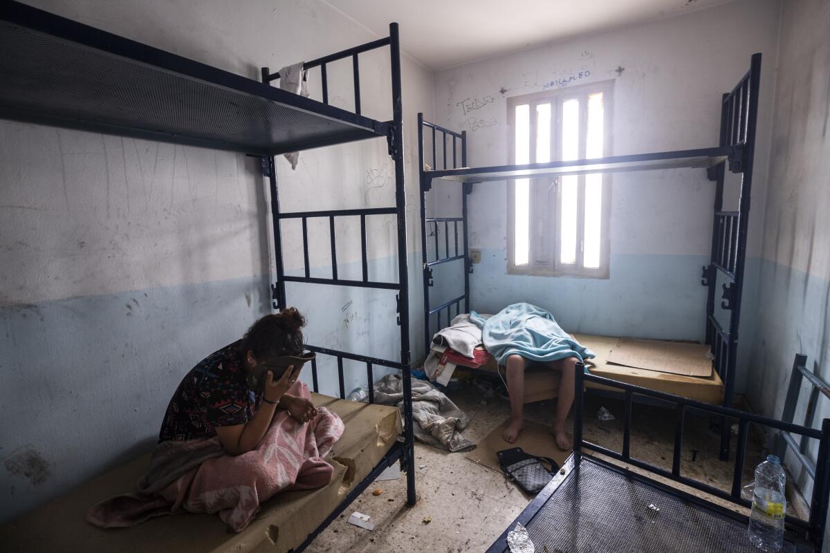 Minors who crossed into Spain take shelter inside an abandoned building in Ceuta.
