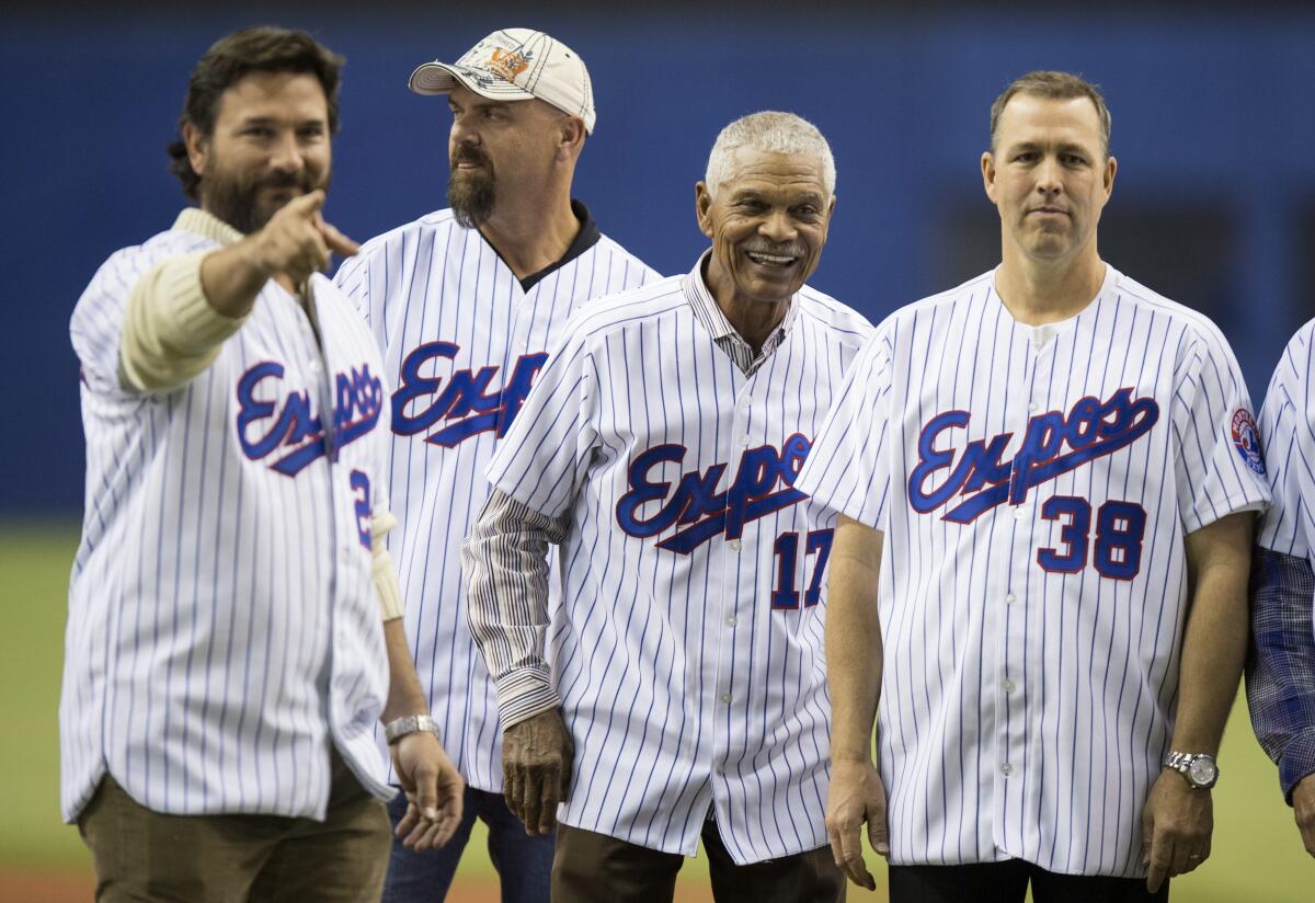 Former Montreal Expos (from left) Darren Fletcher, Larry Walker, manager Felipe alou and Denis Boucher.