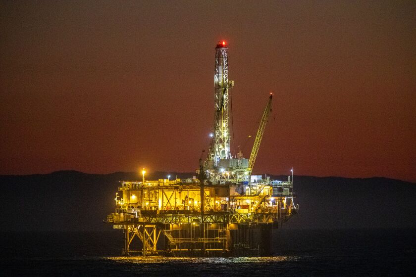 Huntington Beach, CA - October 14: A view of oil platform Emmy off the coast of Huntington Beach at dusk Thursday, October 14, 2021. (Allen J. Schaben / Los Angeles Times)