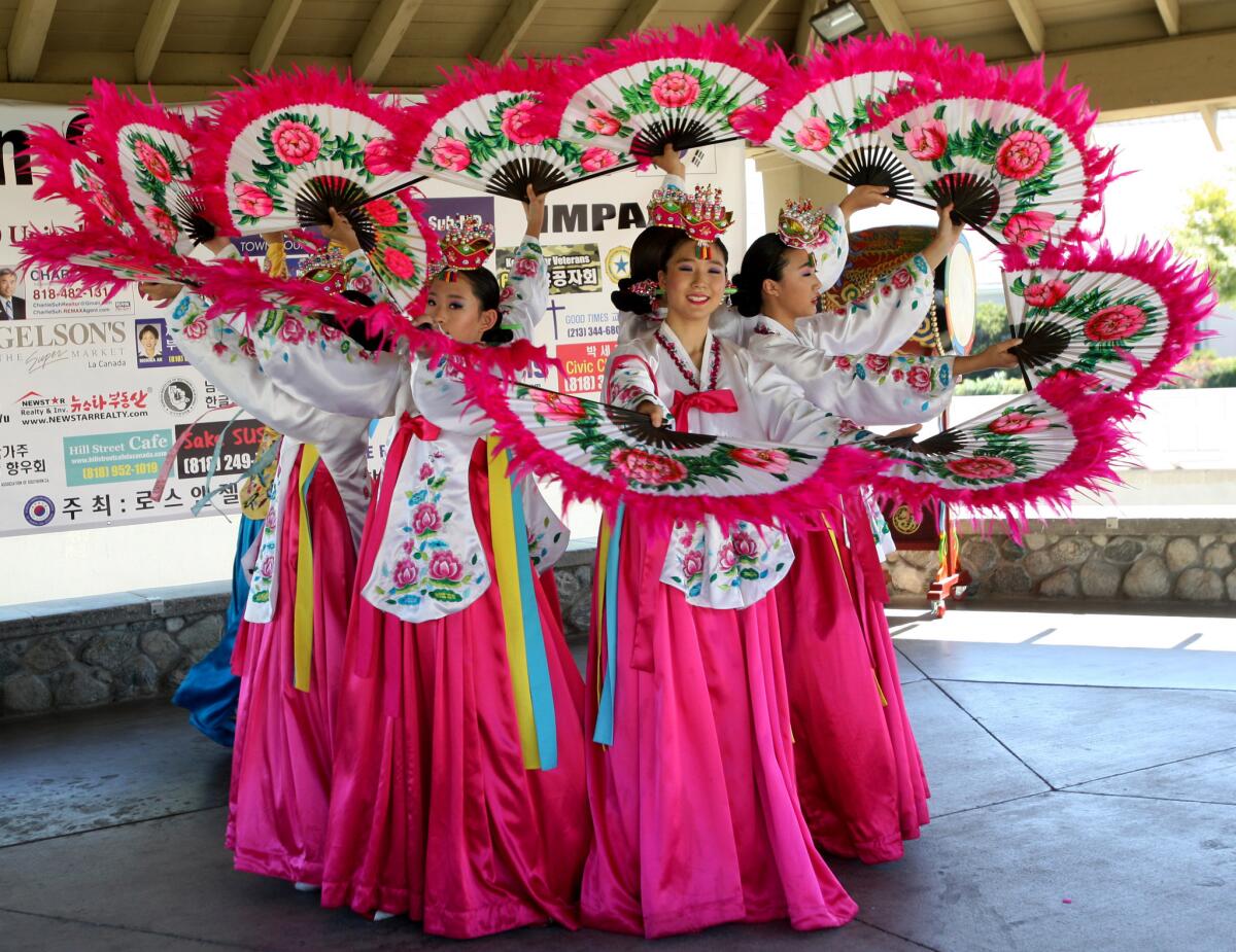 The Kimeung Hwa Korean Dance Company performs the fan dance during the Korean Culture Festival at Memorial Park in La Cañada Flintridge on Saturday, September 26, 2015. The event was sponsored by the Korean American Federation of North L.A. and the Korean Cultural Heritage Foundation.