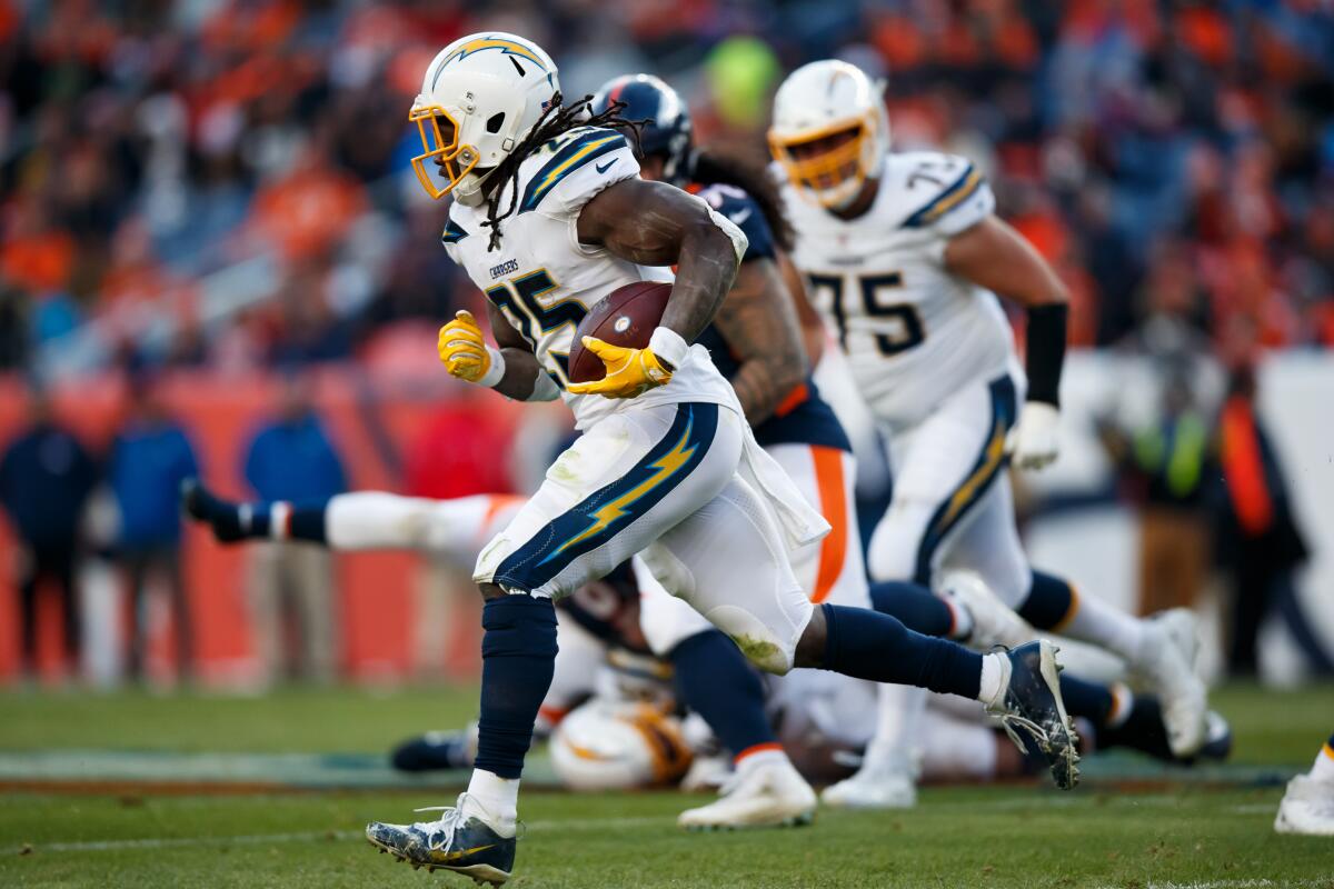 Former Chargers running back Melvin Gordon runs against his new team, the Denver Broncos, in an AFC West game.