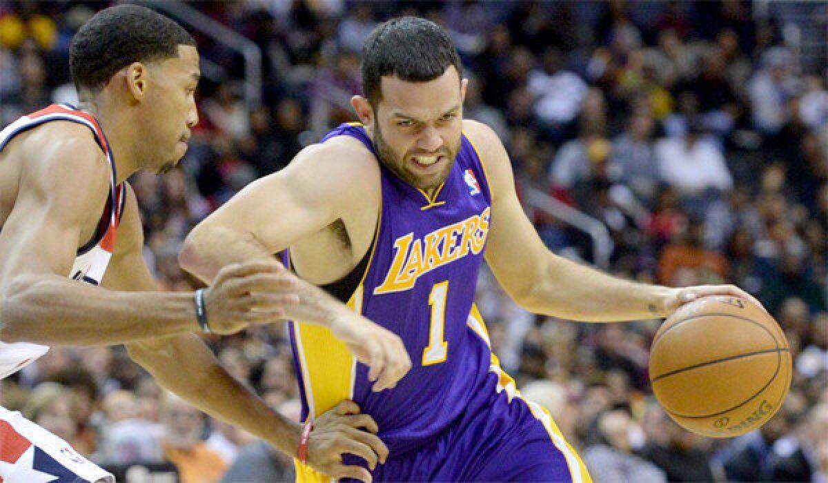 The Lakers' Jordan Farmar drives ahead in a game against the Washington Wizards
