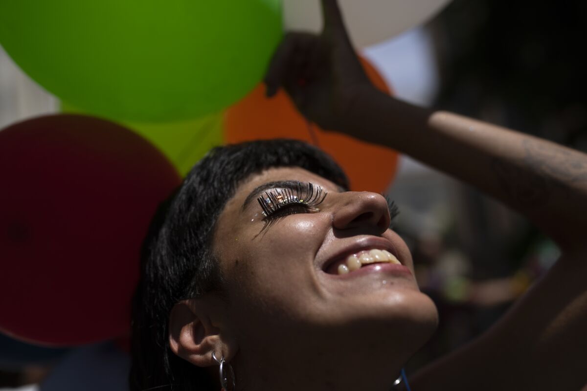 A smiling reveler at an unofficial carnival block party in Rio