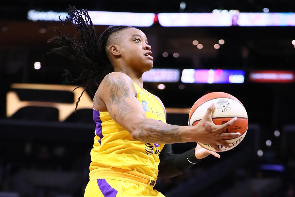The Sparks' Riquna Williams drives to the basket during a game June 30, 2019.