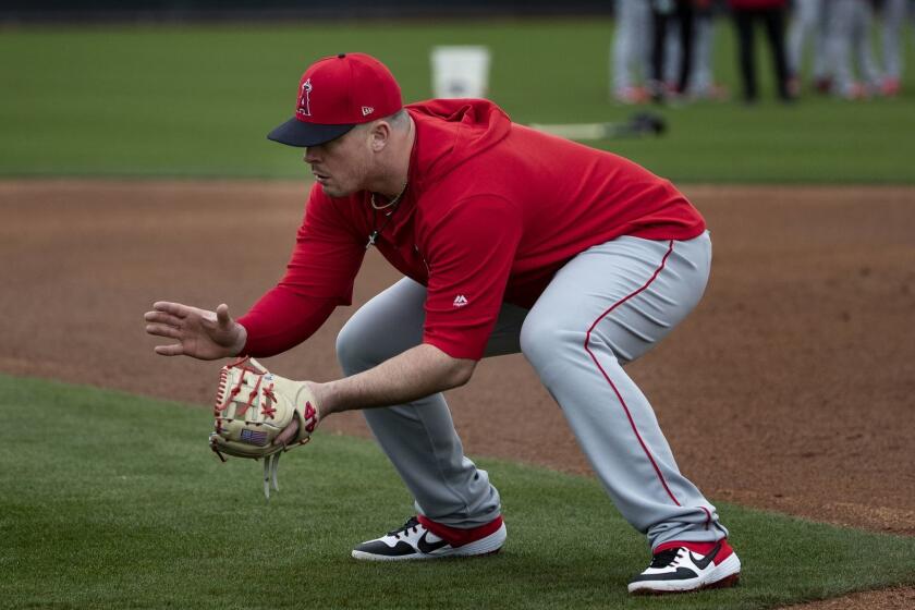 TEMPE, AZ - FEBRUARY 18, 2019: Angels first baseman Justin Bour takes grounders during spring training at Tempe Diablo Stadium on February 18, 2019 in Tempe, Arizona.(Gina Ferazzi/Los AngelesTimes)