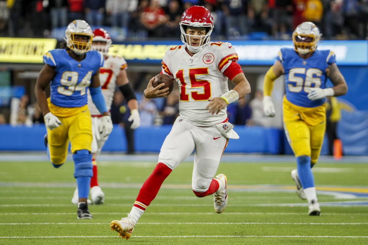 Chiefs quarterback Patrick Mahomes scrambles for a first down on a game-winning drive against the Chargers on Nov. 20, 2022.