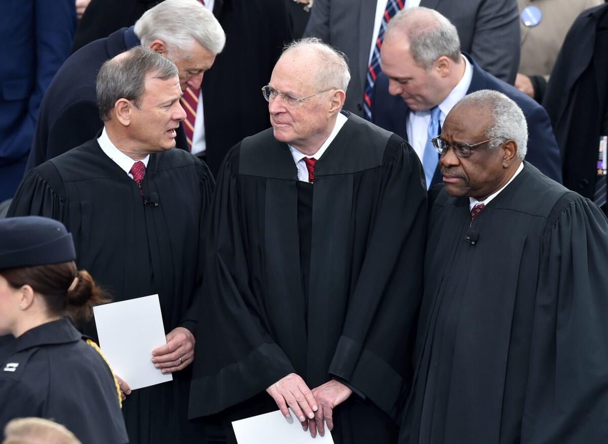 Justice Anthony M. Kennedy, center, joins other Supreme Court justices and officials at President Trump's inauguration in 2017.