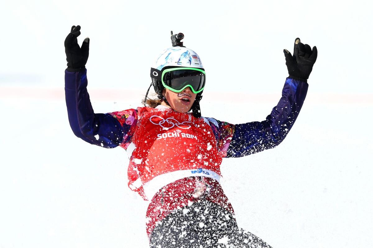 Gold medalist Eva Samkova of the Czech Republic celebrates after winning a women's snowboard cross quarterfinal on Sunday at the Sochi Olympics.