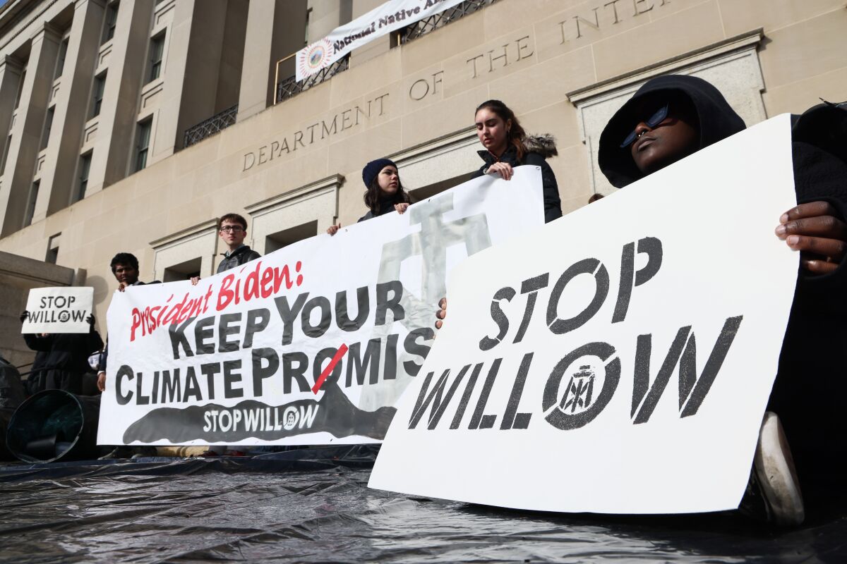 Climate activists hold a demonstration urging President Biden to reject the Willow Project in Washington on Nov. 17. 