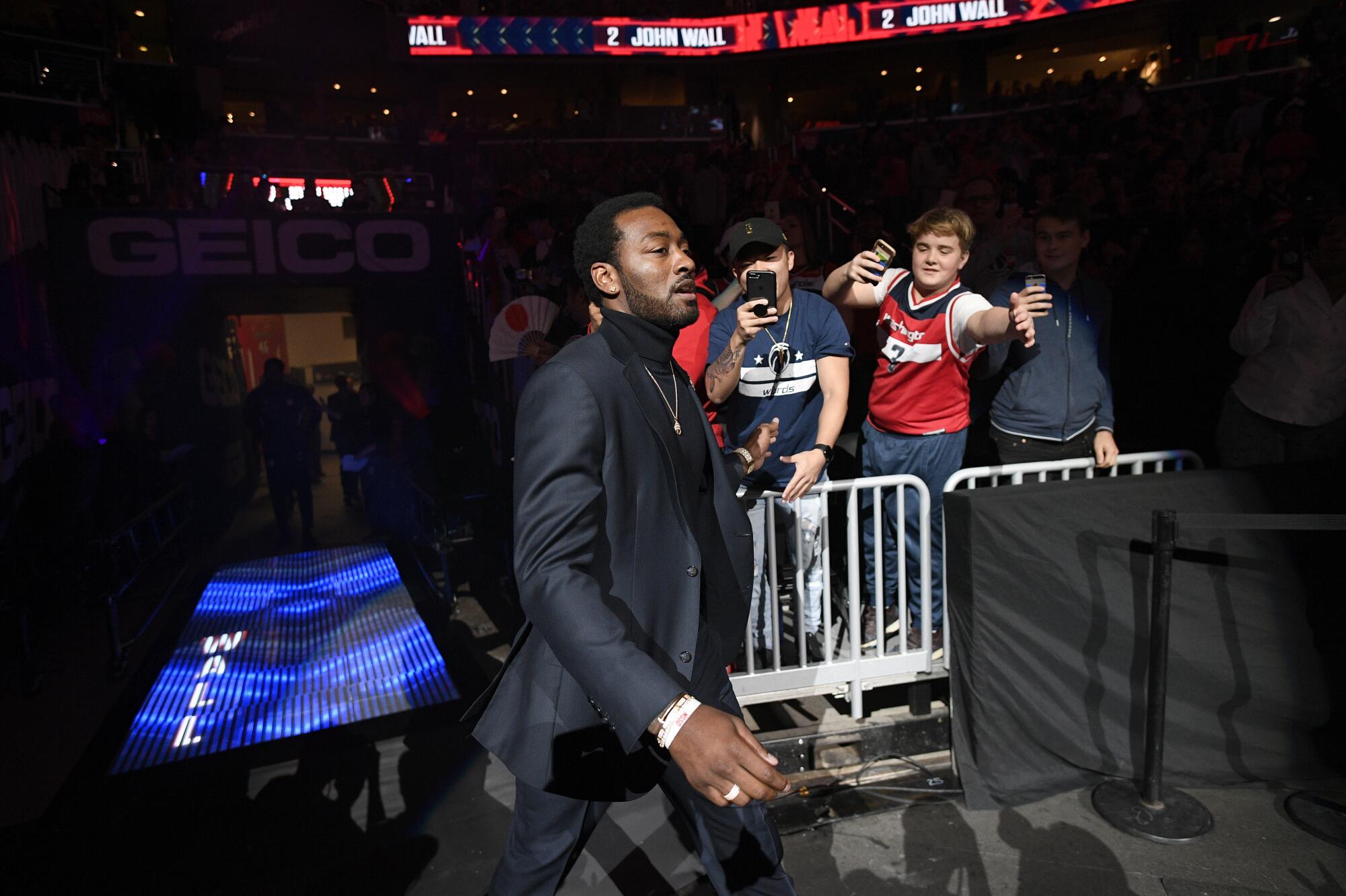 Wizards guard John Wall enters the court during player introductions in 2019.