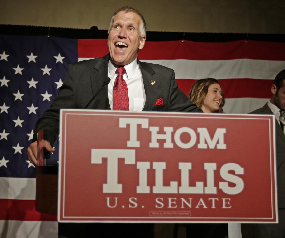 Thom Tillis speaks to supporters at an election night rally in Charlotte, N.C., after winning the Republican nomination for the U.S. Senate.