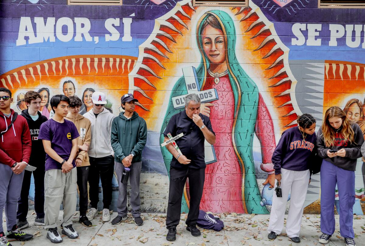 Enrique Morones, with Gente Unida, leads a silent vigil for victims of violence in Chicano Park