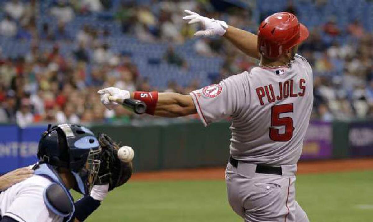 Albert Pujols fouls off a pitch in the first inning.