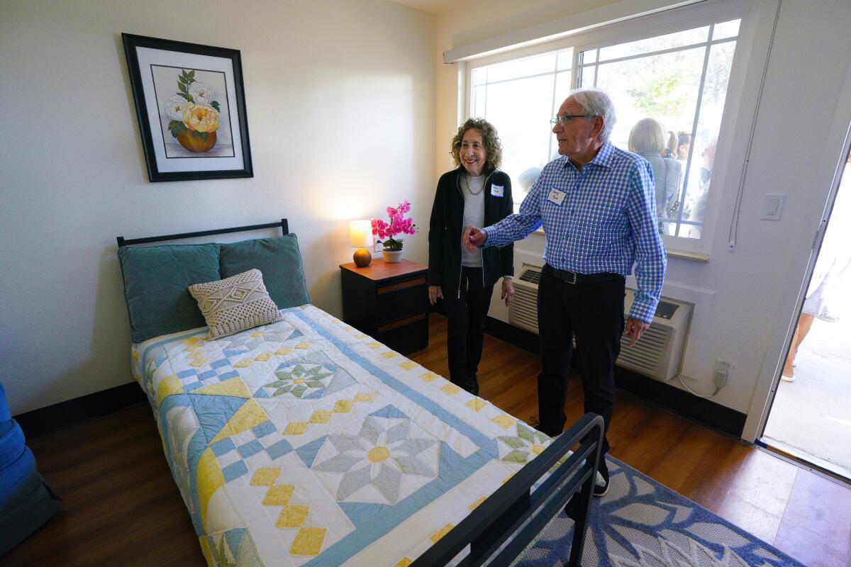  Jerry and Carole Turk tour one of 60 residential rooms at the Abraham & Lillian Turk Recuperative Care Center in Escondido.
