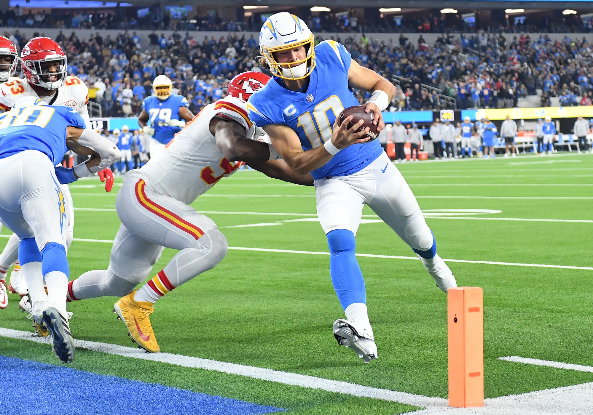 Chargers quarterback Justin Herbert beats the Chiefs defense to score a touchdown in the second quarter.
