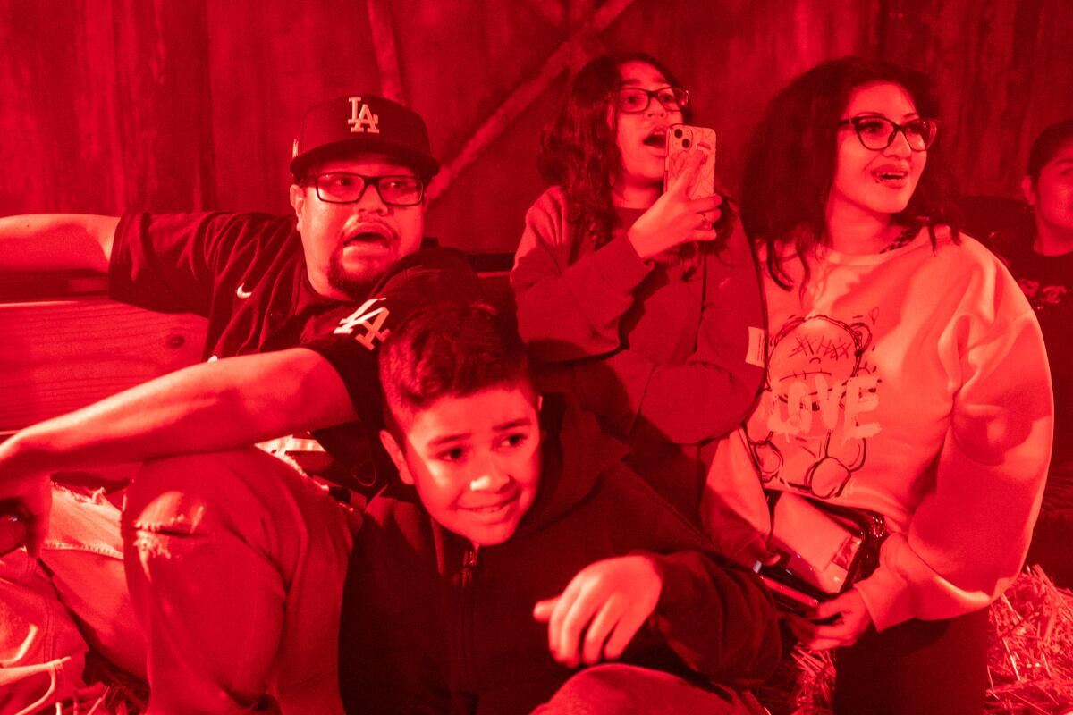 The Saldana family from Reseda enjoy a ride on the Haunted Hayride in Griffith Park.