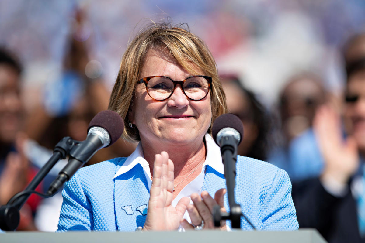 Tennessee Titans owner Amy Adams Strunk smiles while making a presentation at halftime.