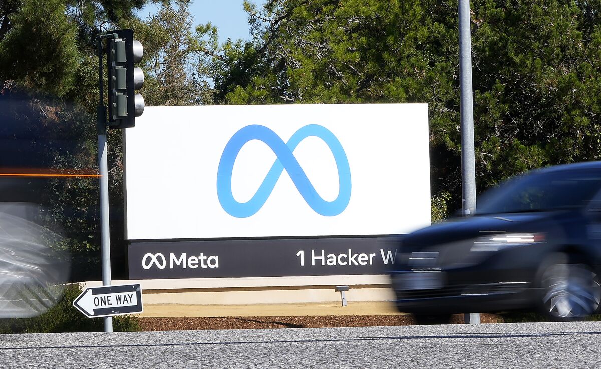 FILE - Facebook unveiled their new Meta sign at the company headquarters in Menlo Park, Calif., on Oct. 28, 2021. Facebook parent Meta Platforms Inc. has settled a decade-old class action lawsuit, Tuesday, Feb. 15, 2022, over the company’s use of “cookies” in 2010 and 2011 that tracked people online even after they logged off the Facebook platform. As part of the proposed settlement, which must still be approved by a judge, Meta has agreed to delete all the data it wrongfully collected during the period. (AP Photo/Tony Avelar, File)