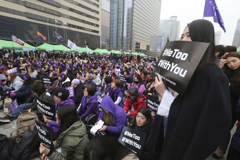 South Korean women supporting the MeToo movement stage a rally to mark the upcoming International Women's Day in Seoul, South Korea, Sunday, March 4, 2018. (AP Photo/Ahn Young-joon)