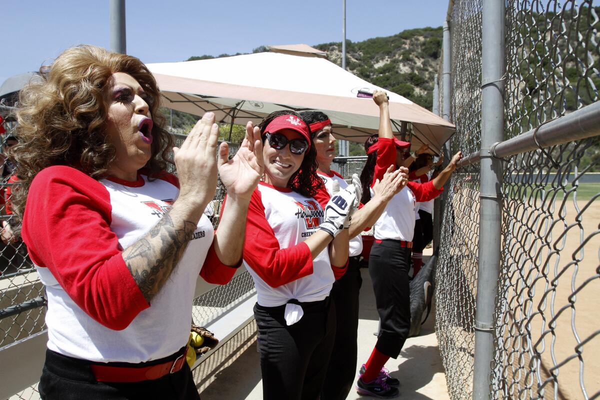 Members of the West Hollywood Cheerleaders sofball team cheer for their team during the 3rd annual Drag Queen Softball World Series vs. the L.A. Sisters of Perpetual Indulgence at the Glendale Sports Complex in Glendale on Saturday, May 10, 2014.