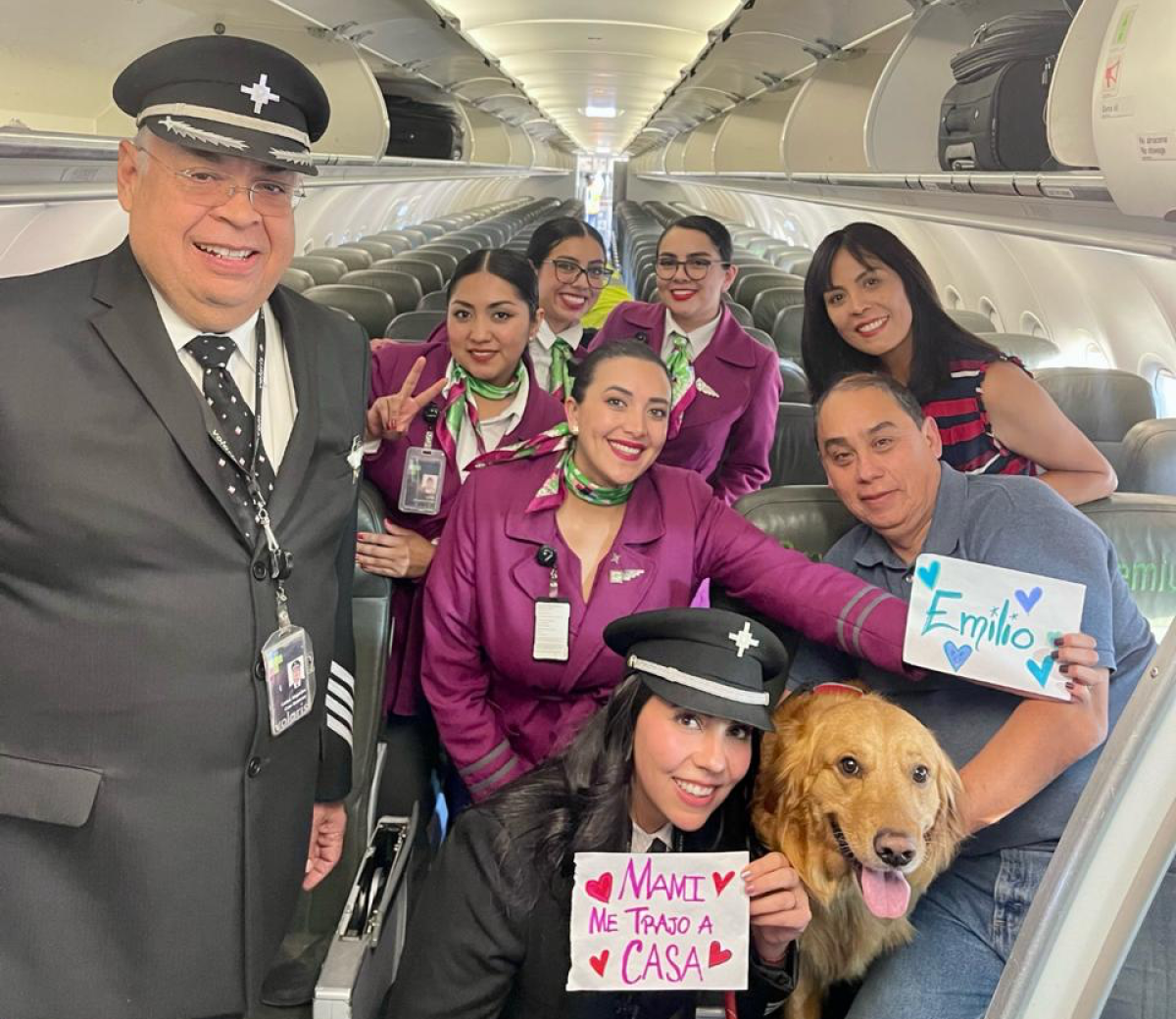 Larissa Astivia poses with her family along with the flight crew.  It was the family's first time flying as passengers.