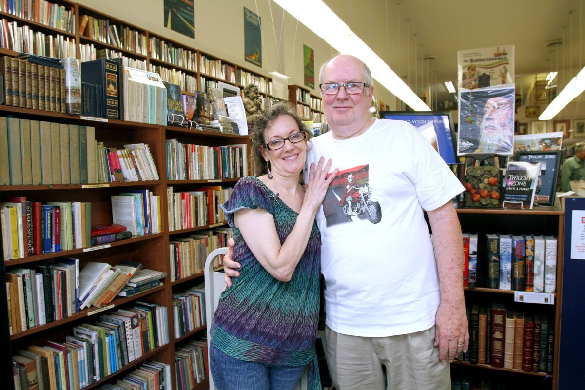 Bookfellows bookstore owners Christine and Malcolm Bell pose at their store.