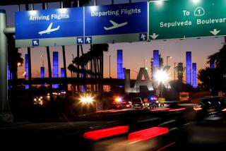 FILE - In this Nov. 2, 2013 file photo lighted pylons line the entrance to Los Angeles International Airport in Los Angeles. At the end of the month, travelers will not be able to hail a rideshare or taxi outside terminals at Los Angeles International Airport. LAX announced Friday, Oct. 4, 2019, that travelers will instead have to take shuttles or walk to a special location outside the central terminal area where they can be picked up. (AP Photo/Reed Saxon,File)